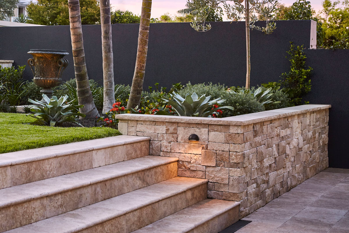gardens at night step light on sandstone wall lighting up staircase