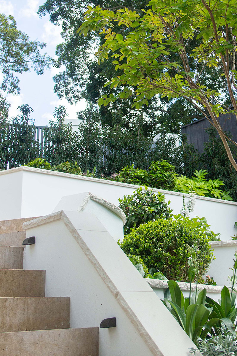 Gardens at Night step lighting on flight of stairs with in tiered garden by Inspired Exteriors Charlie Albone