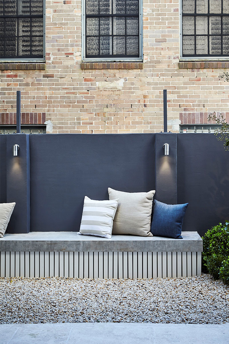 Gardens at Night wall lighting in courtyard setting with bench seat