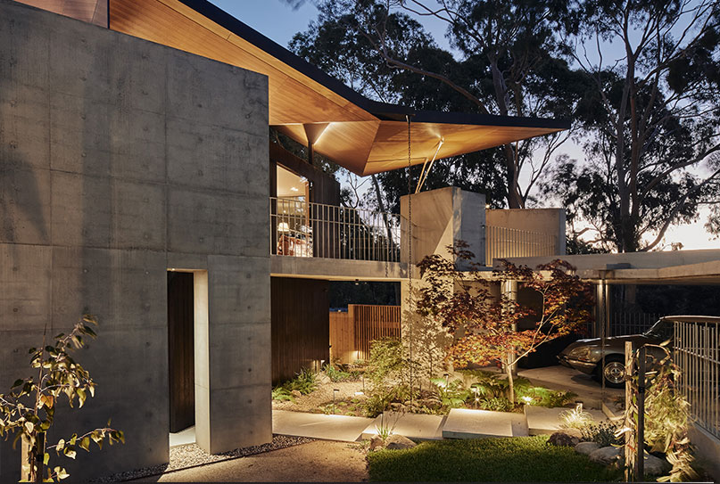 Gardens at Night lights illuminating Japanese style garden of modern residence at night