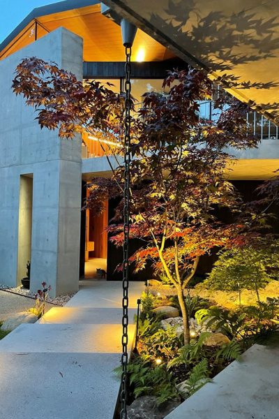 Gardens at Night path and accent lights illuminating Japanese style garden at night