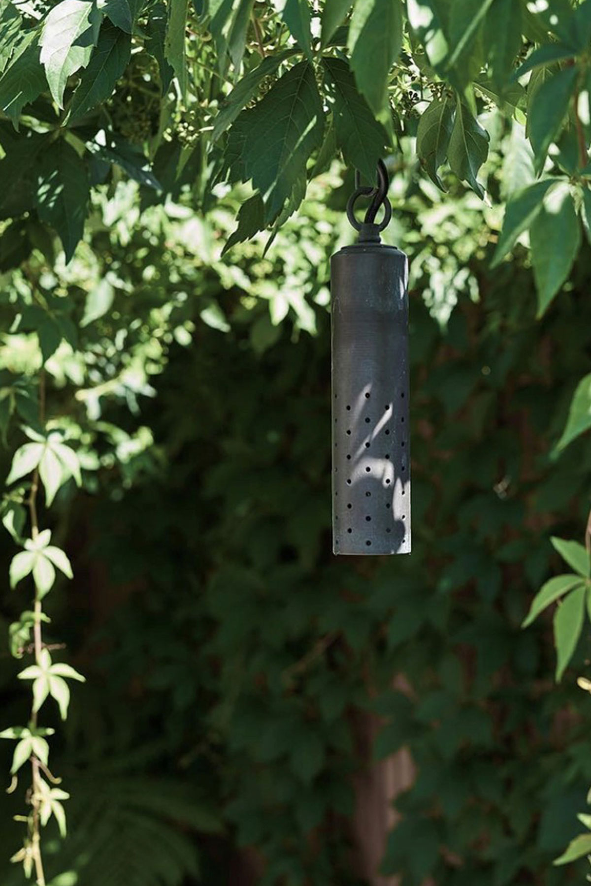 Gardens at Night Hanging Light Speckle overhead light in landscaped garden