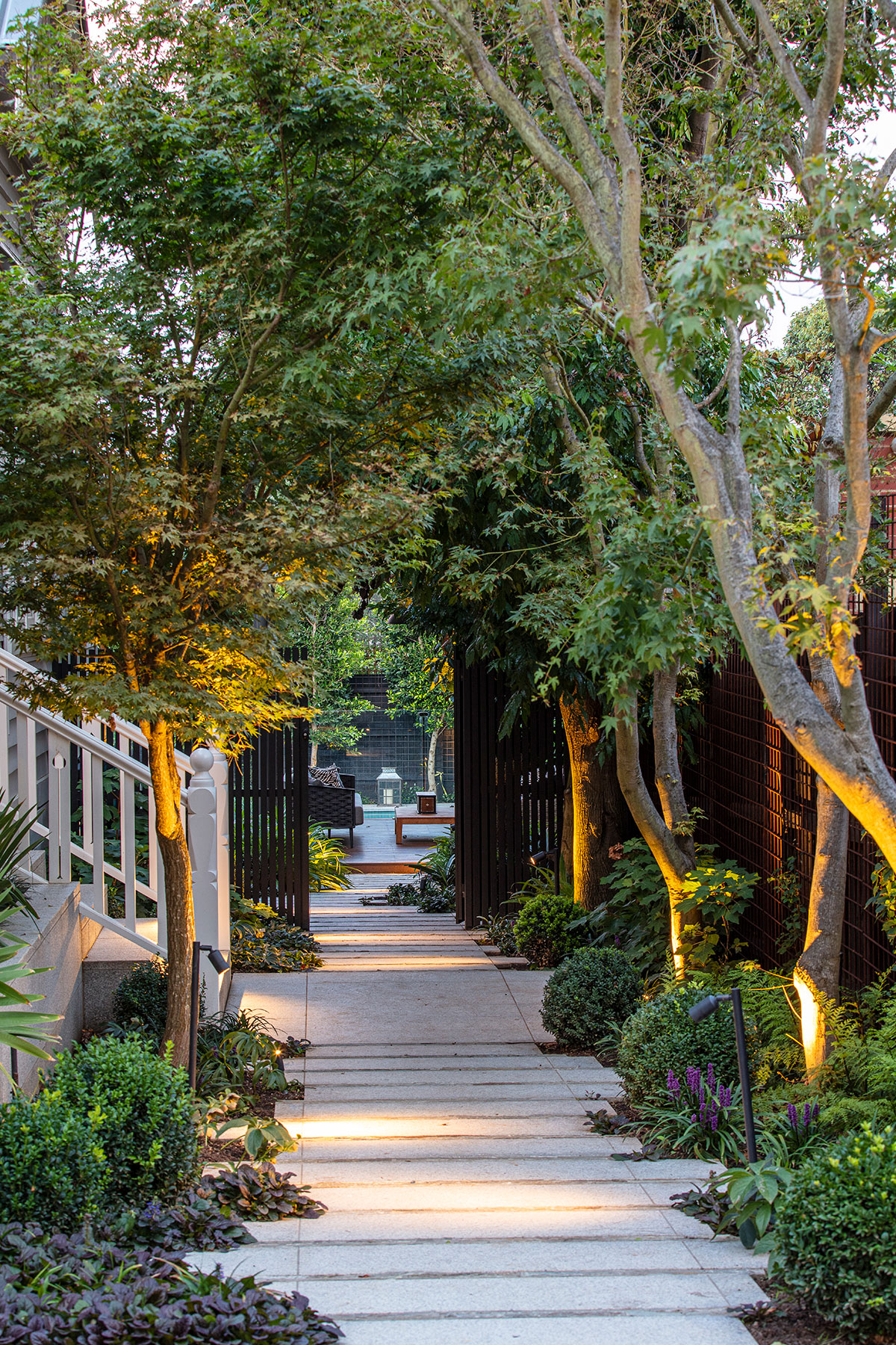 Gardens at Night adjustable pole light illuminating garden path in landscaped garden Melbourne Australia