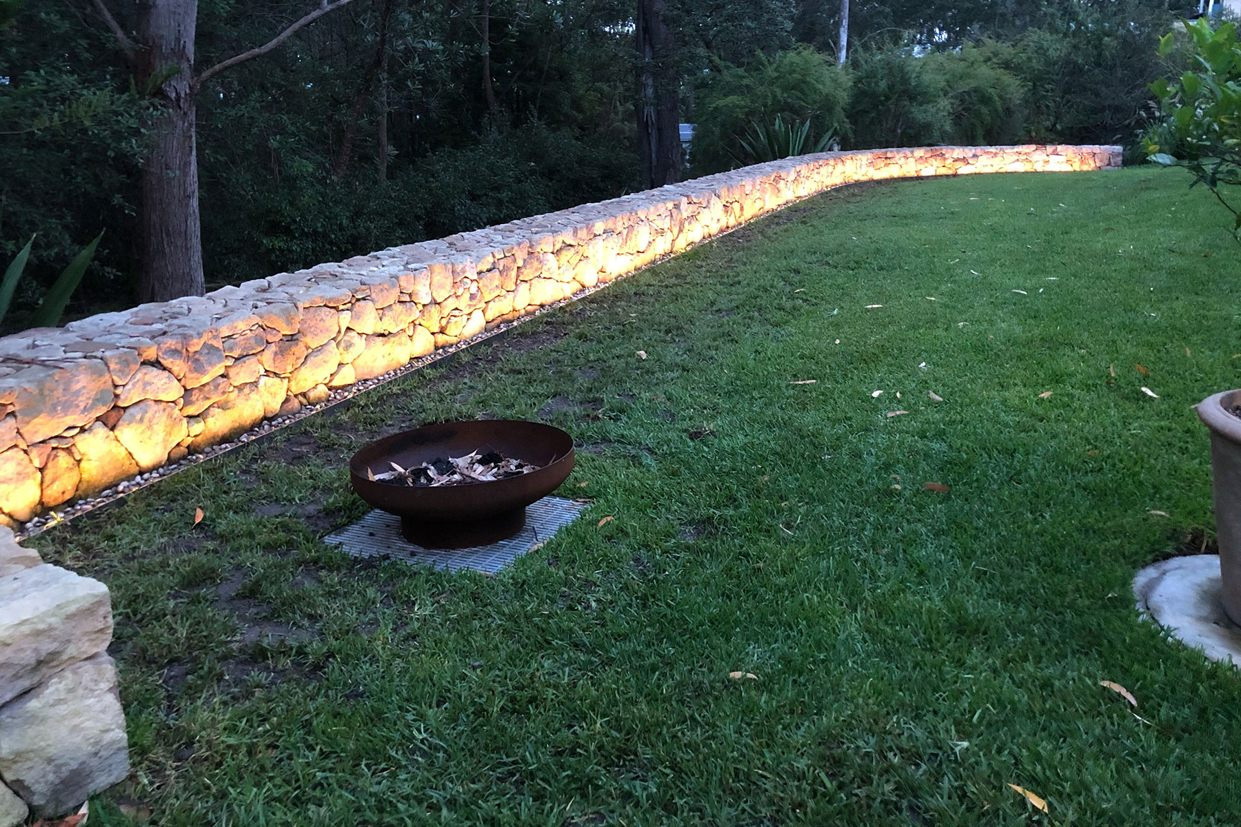 Gardens at Night Neon Side Flex linear strip led light along feature wall in landscaped garden