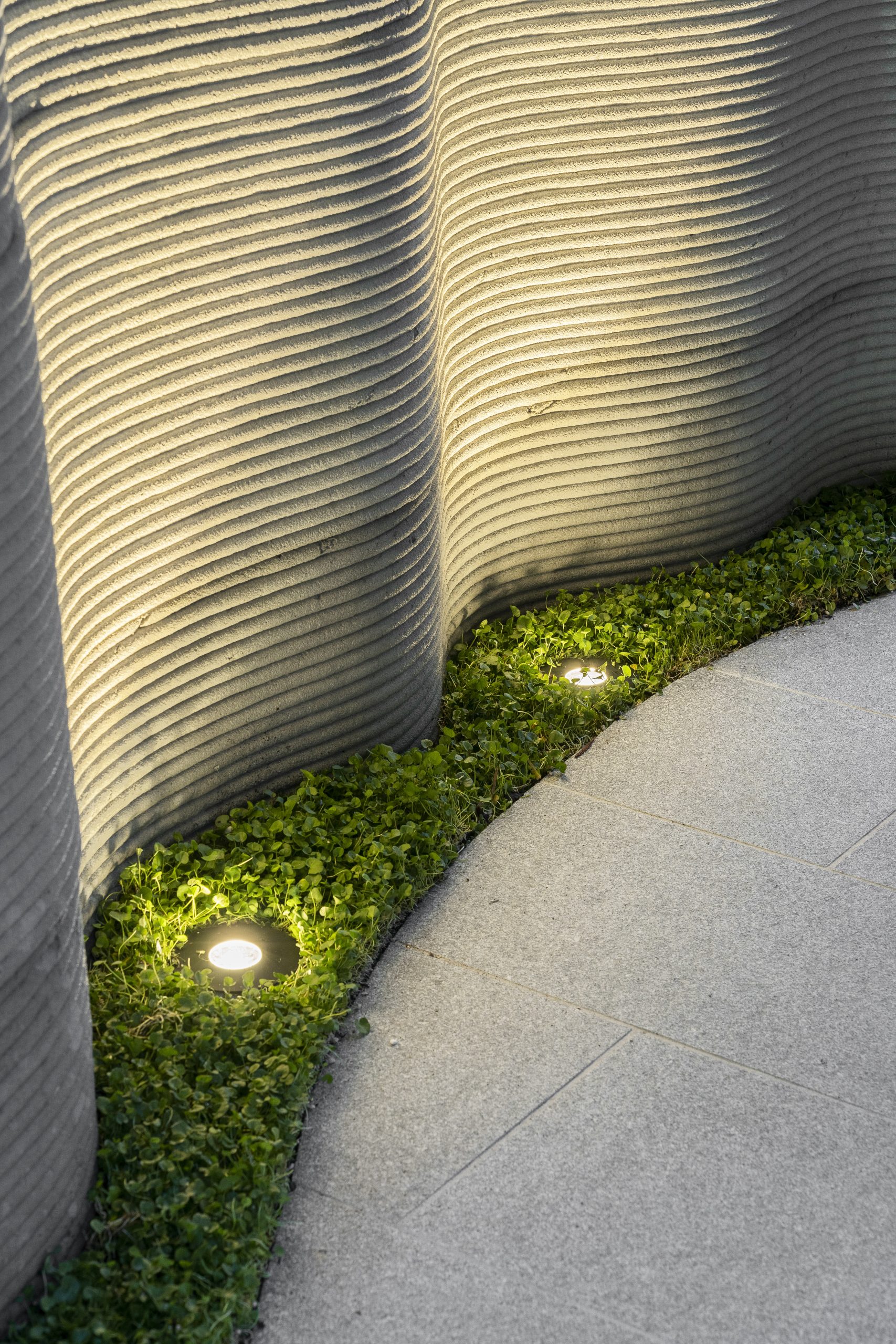 Inground Light Bronze supplied by Gardens at Night for Inge Jabara lighting textured outdoor wall